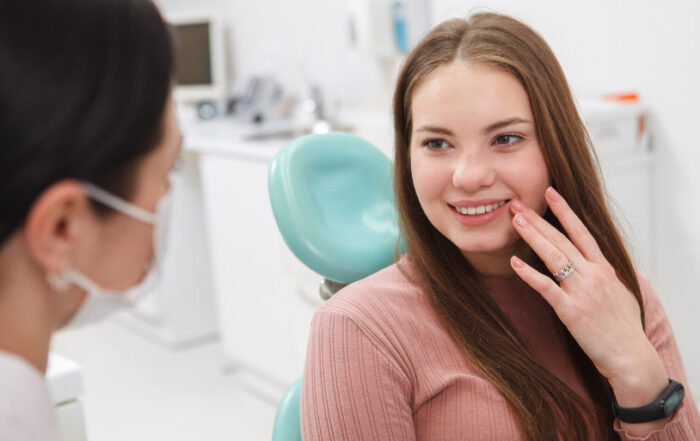 Woman Wondering What Happens At Your First Dental Appointment